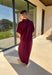Effortless and versatile, this burgundy midi dress is an easy favorite for fall. Designed with a band collar v-neckline and elasticated short sleeves, it offers both structure and comfort. Side pockets keep it practical, while the soft, stretchy fabric blend makes it perfect for all-day wear. You'll find yourself reaching for this dress all season long!