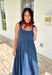 This dark wash sleeveless midi dress is the kind of effortless staple you’ll reach for all summer long! The rich denim wash gives it a slightly elevated feel, while the pleating along the front adds a soft, flattering detail. The smocked back keeps the fit comfortable and easy, making it perfect for all-day wear. Lightweight and breathable in 100% cotton, it’s ideal for everything from casual days to dinner plans. 