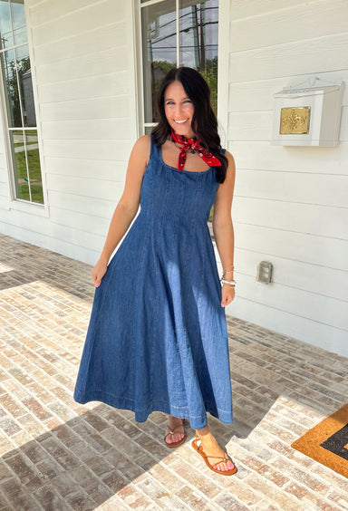 This dark wash sleeveless midi dress is the kind of effortless staple you’ll reach for all summer long! The rich denim wash gives it a slightly elevated feel, while the pleating along the front adds a soft, flattering detail. The smocked back keeps the fit comfortable and easy, making it perfect for all-day wear. Lightweight and breathable in 100% cotton, it’s ideal for everything from casual days to dinner plans. 