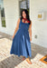 This dark wash sleeveless midi dress is the kind of effortless staple you’ll reach for all summer long! The rich denim wash gives it a slightly elevated feel, while the pleating along the front adds a soft, flattering detail. The smocked back keeps the fit comfortable and easy, making it perfect for all-day wear. Lightweight and breathable in 100% cotton, it’s ideal for everything from casual days to dinner plans. 