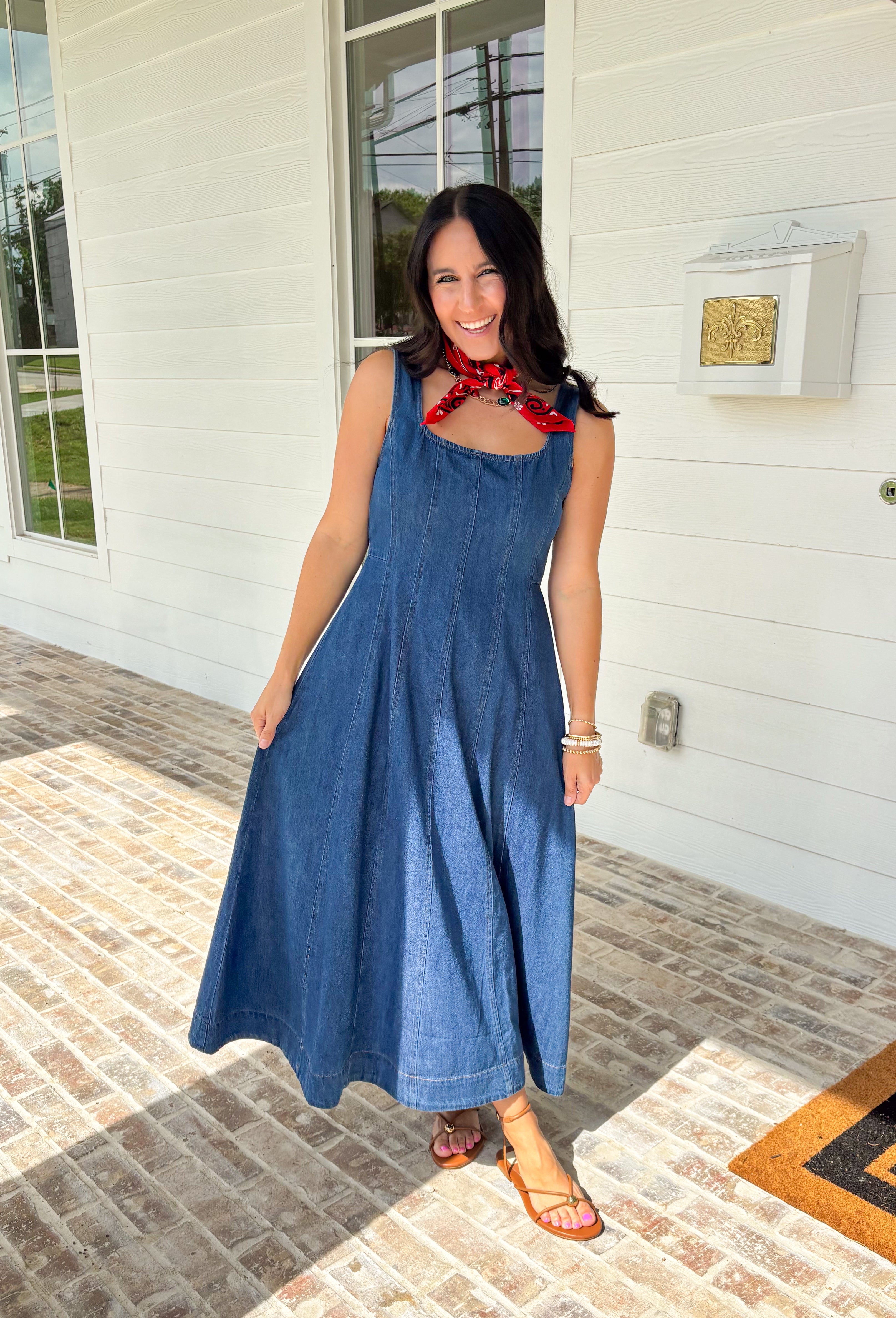 This dark wash sleeveless midi dress is the kind of effortless staple you’ll reach for all summer long! The rich denim wash gives it a slightly elevated feel, while the pleating along the front adds a soft, flattering detail. The smocked back keeps the fit comfortable and easy, making it perfect for all-day wear. Lightweight and breathable in 100% cotton, it’s ideal for everything from casual days to dinner plans. 