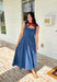 This dark wash sleeveless midi dress is the kind of effortless staple you’ll reach for all summer long! The rich denim wash gives it a slightly elevated feel, while the pleating along the front adds a soft, flattering detail. The smocked back keeps the fit comfortable and easy, making it perfect for all-day wear. Lightweight and breathable in 100% cotton, it’s ideal for everything from casual days to dinner plans. 