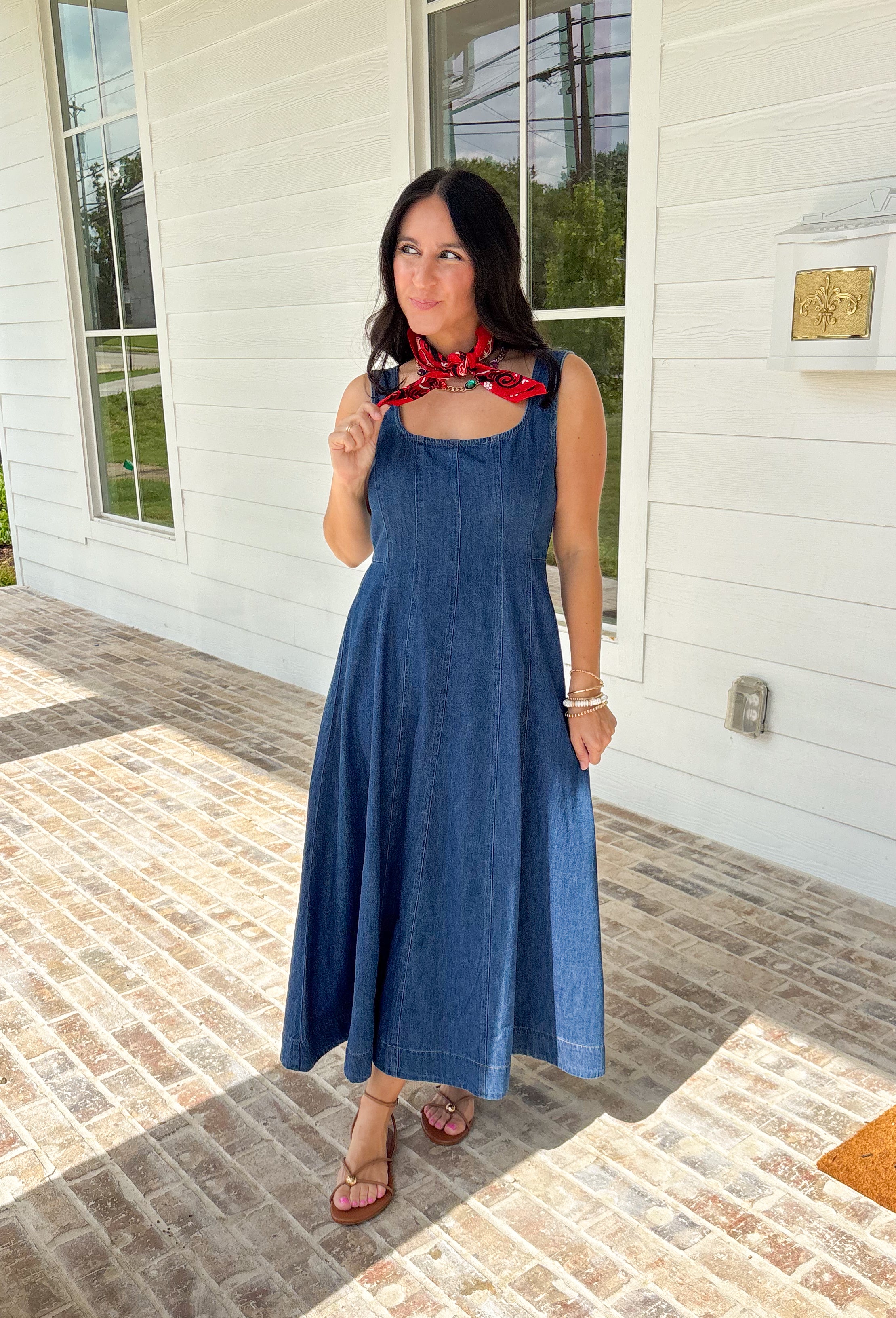This dark wash sleeveless midi dress is the kind of effortless staple you’ll reach for all summer long! The rich denim wash gives it a slightly elevated feel, while the pleating along the front adds a soft, flattering detail. The smocked back keeps the fit comfortable and easy, making it perfect for all-day wear. Lightweight and breathable in 100% cotton, it’s ideal for everything from casual days to dinner plans. 