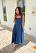 This dark wash sleeveless midi dress is the kind of effortless staple you’ll reach for all summer long! The rich denim wash gives it a slightly elevated feel, while the pleating along the front adds a soft, flattering detail. The smocked back keeps the fit comfortable and easy, making it perfect for all-day wear. Lightweight and breathable in 100% cotton, it’s ideal for everything from casual days to dinner plans. 