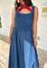 This dark wash sleeveless midi dress is the kind of effortless staple you’ll reach for all summer long! The rich denim wash gives it a slightly elevated feel, while the pleating along the front adds a soft, flattering detail. The smocked back keeps the fit comfortable and easy, making it perfect for all-day wear. Lightweight and breathable in 100% cotton, it’s ideal for everything from casual days to dinner plans. 