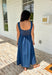 This dark wash sleeveless midi dress is the kind of effortless staple you’ll reach for all summer long! The rich denim wash gives it a slightly elevated feel, while the pleating along the front adds a soft, flattering detail. The smocked back keeps the fit comfortable and easy, making it perfect for all-day wear. Lightweight and breathable in 100% cotton, it’s ideal for everything from casual days to dinner plans. 