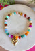 Add a meaningful finishing touch to your favorite outfits with this beautifully crafted beaded necklace. Featuring rich shades of autumn beads accented with delicate gold beads throughout, this timeless piece is finished with a gold heart charm for the perfect blend of classic style and everyday elegance. Whether worn on its own or layered with your favorite chains, this versatile necklace adds just the right amount of charm to everything from cozy sweaters to dresses and blouses all season long.