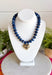 Add a meaningful finishing touch to your favorite outfits with this beautifully crafted beaded necklace. Featuring rich navy beads accented with delicate gold beads throughout, this timeless piece is finished with a gold heart charm for the perfect blend of classic style and everyday elegance. Whether worn on its own or layered with your favorite chains, this versatile necklace adds just the right amount of charm to everything from cozy sweaters to dresses and blouses all season long.
