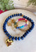 Add a meaningful finishing touch to your favorite outfits with this beautifully crafted beaded necklace. Featuring rich navy beads accented with delicate gold beads throughout, this timeless piece is finished with a gold heart charm for the perfect blend of classic style and everyday elegance. Whether worn on its own or layered with your favorite chains, this versatile necklace adds just the right amount of charm to everything from cozy sweaters to dresses and blouses all season long.