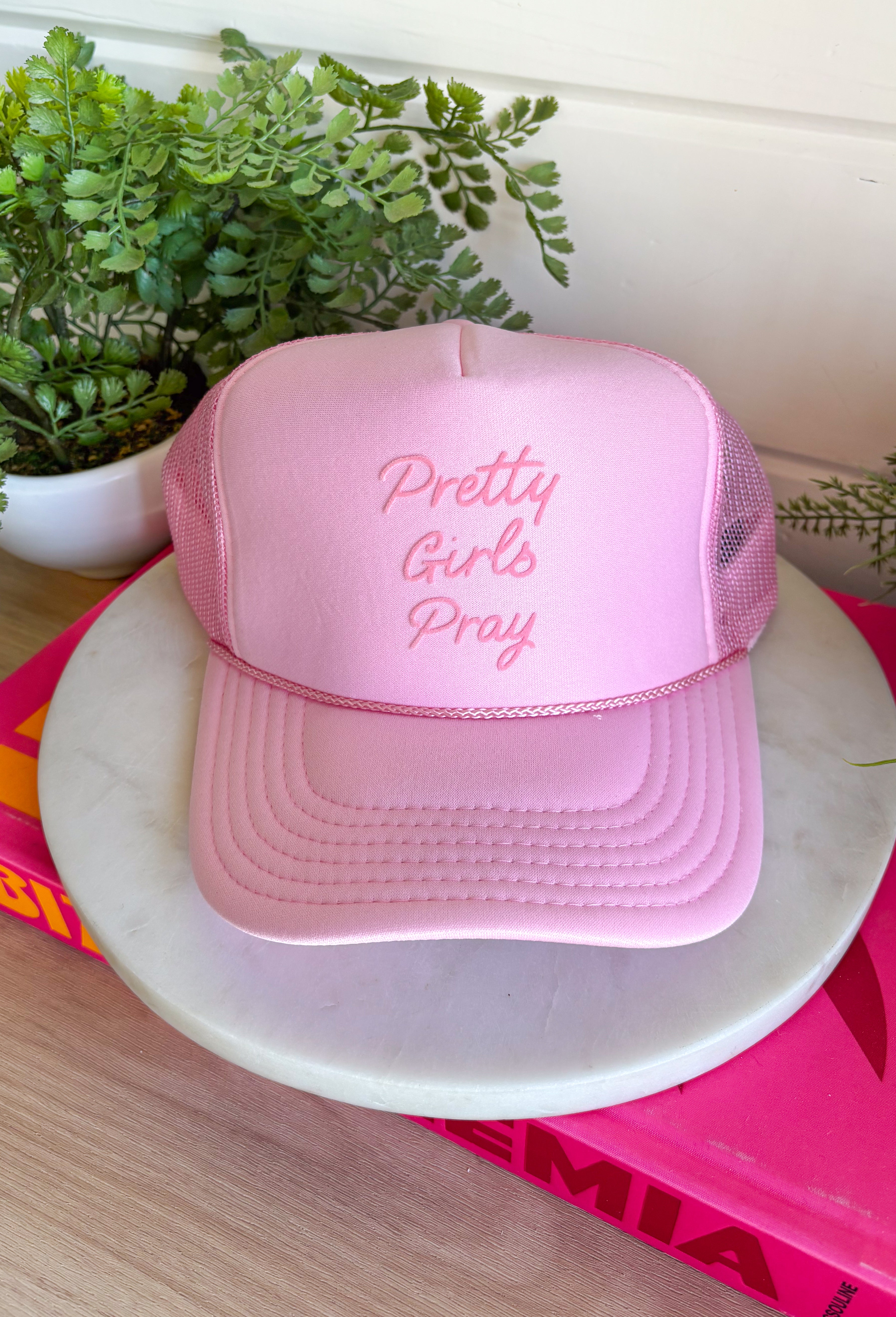This light pink trucker hat is the sweetest blend of style and meaning for summer! Featuring a monochromatic “Pretty Girls Pray” design, it’s a subtle yet powerful statement piece that adds heart to any outfit. The soft pink tone keeps it feminine and easy to style, while the breathable mesh backing and adjustable fit make it perfect for sunny, on-the-go days. Whether you're heading out for errands, time with family, or just soaking up the day, this hat is a feel-good favorite. 