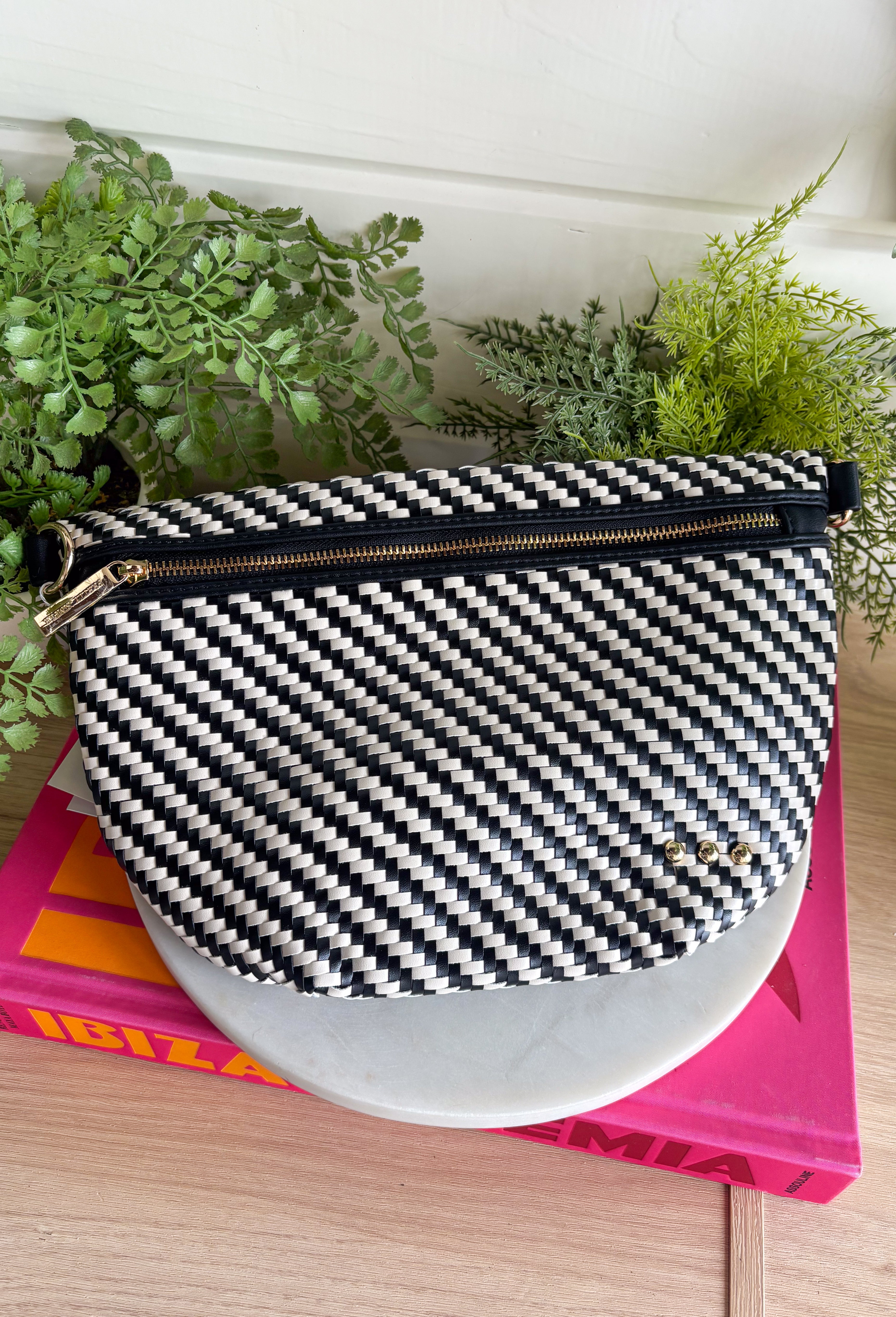 Meet your favorite Westlyn Woven Bum Bag in a new style! Gorgeous diagonal woven design makes this perfect for any occasion! Beautiful hardware with a zipper closure with "Pretty Simple" interior, and a zippered slash pocket on the inside. This crossbody bag is the perfect accessory to elevate any outfit!