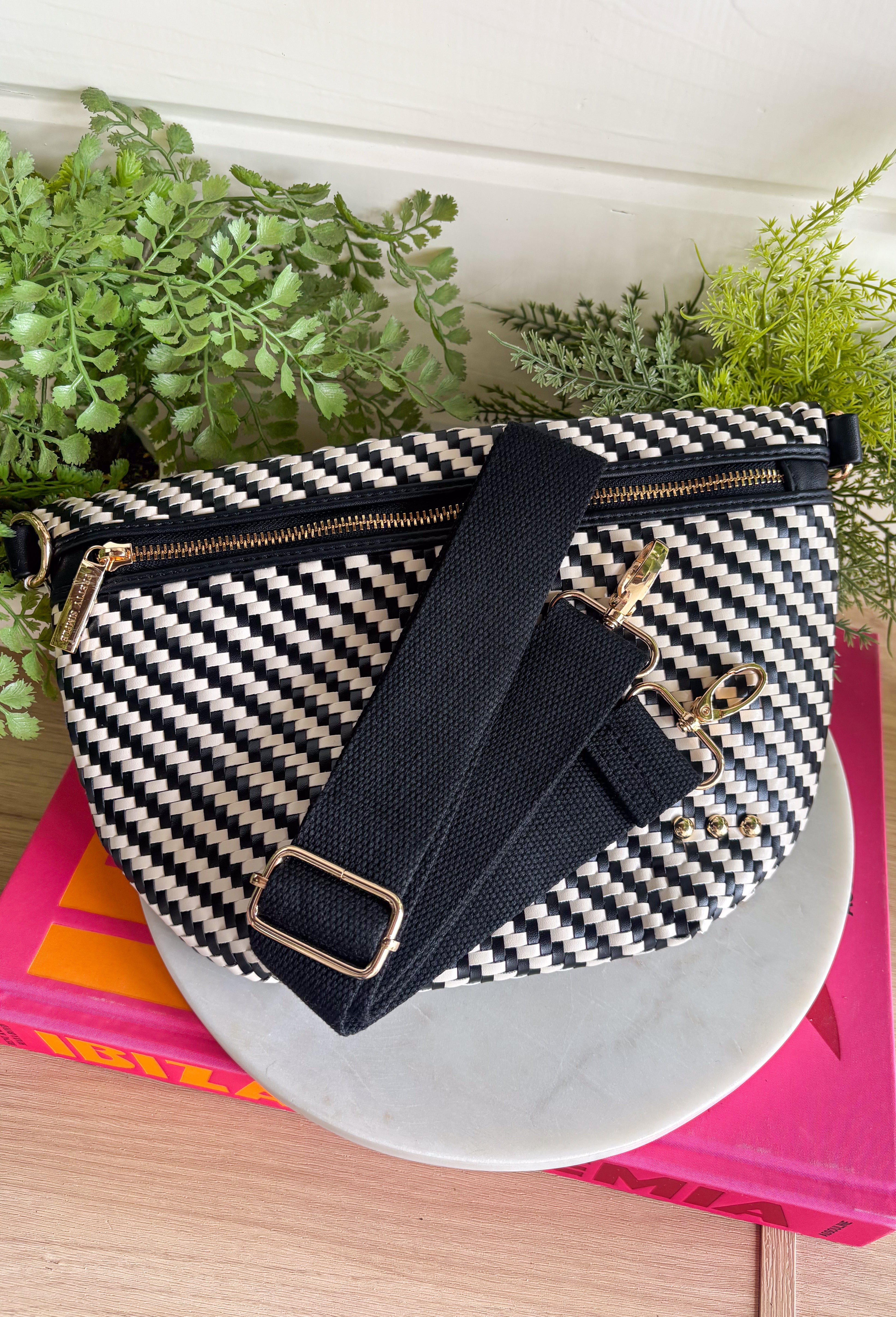 Meet your favorite Westlyn Woven Bum Bag in a new style! Gorgeous diagonal woven design makes this perfect for any occasion! Beautiful hardware with a zipper closure with "Pretty Simple" interior, and a zippered slash pocket on the inside. This crossbody bag is the perfect accessory to elevate any outfit!
