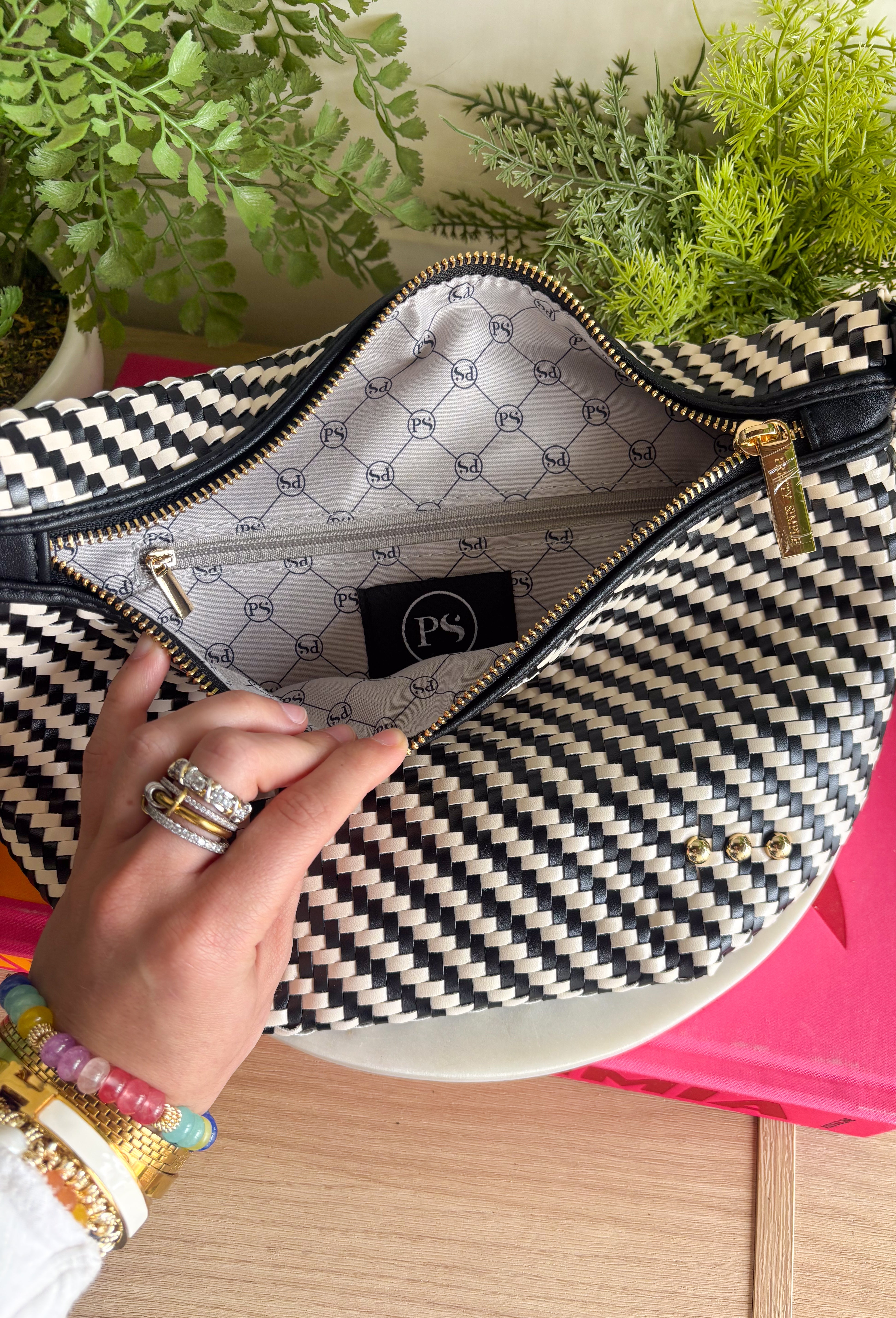 Meet your favorite Westlyn Woven Bum Bag in a new style! Gorgeous diagonal woven design makes this perfect for any occasion! Beautiful hardware with a zipper closure with "Pretty Simple" interior, and a zippered slash pocket on the inside. This crossbody bag is the perfect accessory to elevate any outfit!
