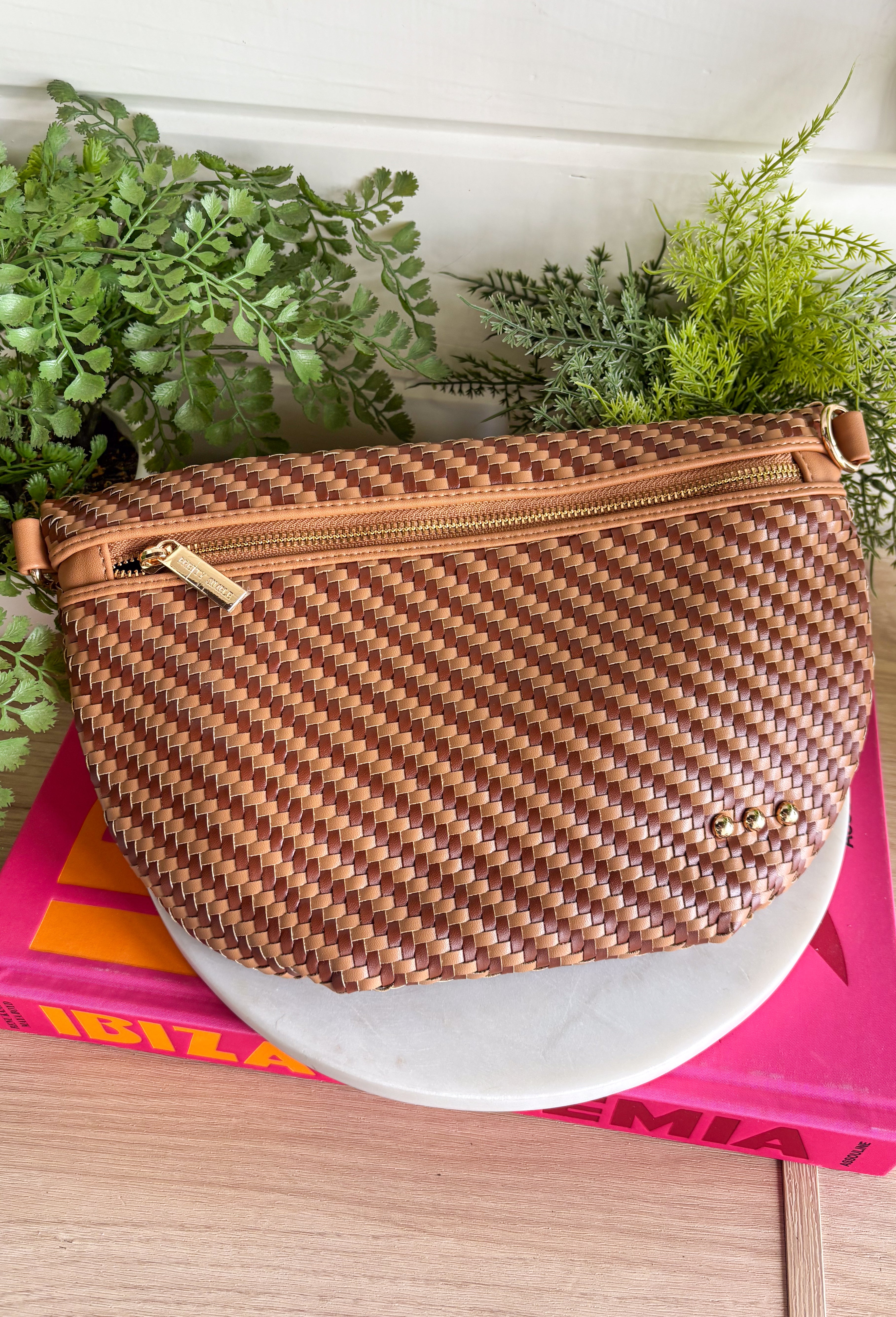 Meet your favorite Westlyn Woven Bum Bag in a new style! Gorgeous diagonal woven design makes this perfect for any occasion! Beautiful hardware with a zipper closure with "Pretty Simple" interior, and a zippered slash pocket on the inside. This crossbody bag is the perfect accessory to elevate any outfit!