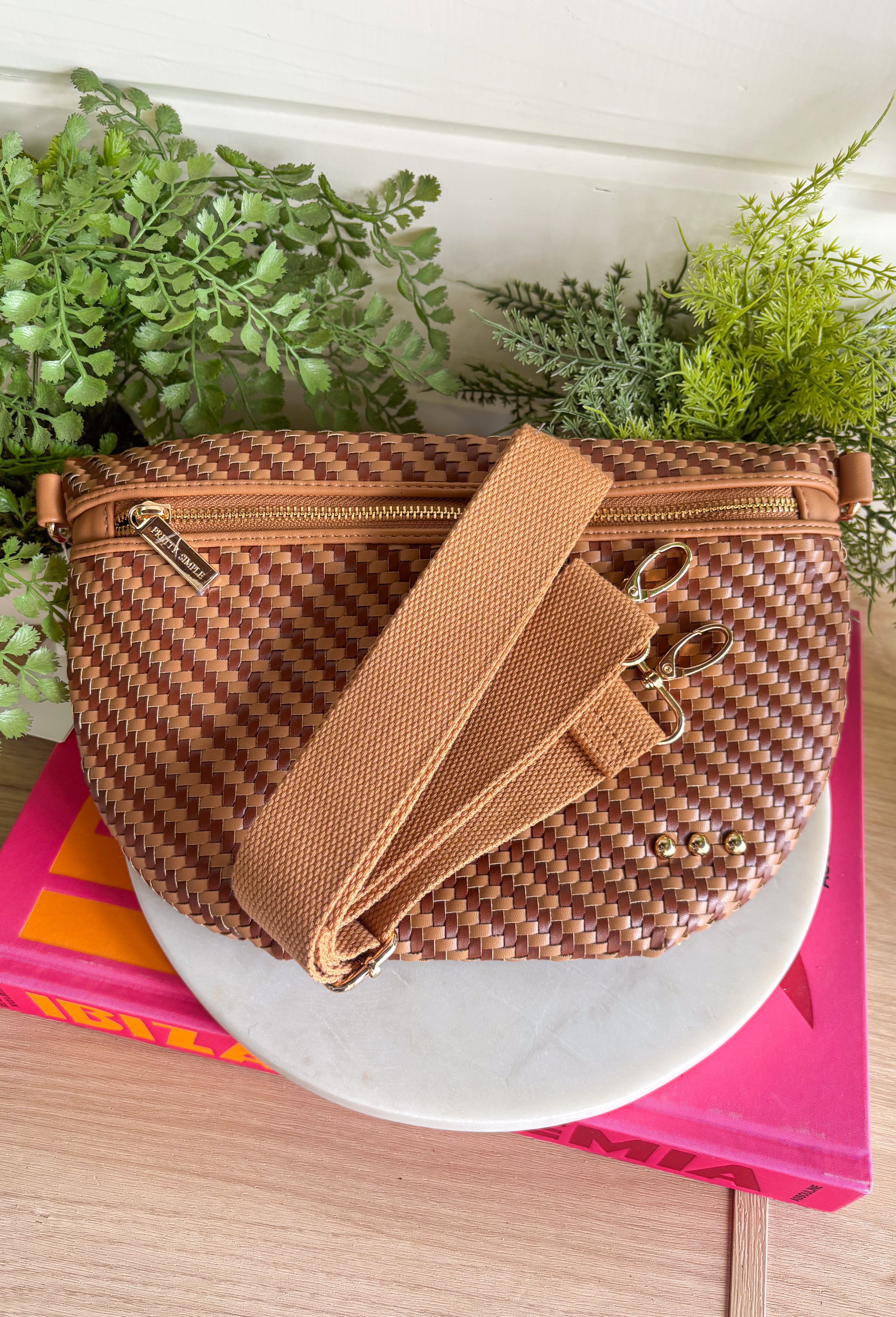 Meet your favorite Westlyn Woven Bum Bag in a new style! Gorgeous diagonal woven design makes this perfect for any occasion! Beautiful hardware with a zipper closure with "Pretty Simple" interior, and a zippered slash pocket on the inside. This crossbody bag is the perfect accessory to elevate any outfit!