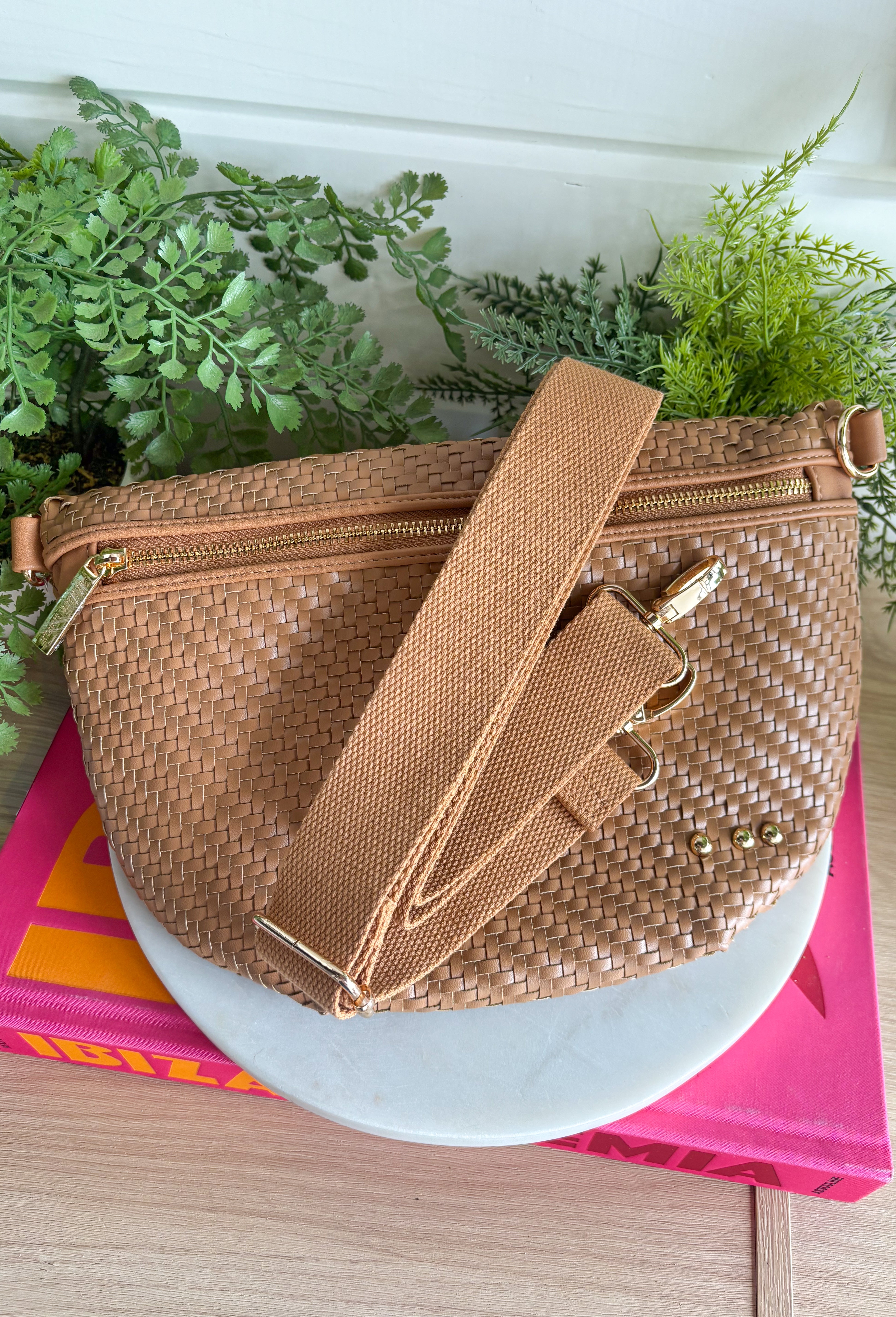 Meet your favorite Westlyn Woven Bum Bag in a new style! Gorgeous diagonal woven design makes this perfect for any occasion! Beautiful hardware with a zipper closure with "Pretty Simple" interior, and a zippered slash pocket on the inside. This crossbody bag is the perfect accessory to elevate any outfit!
