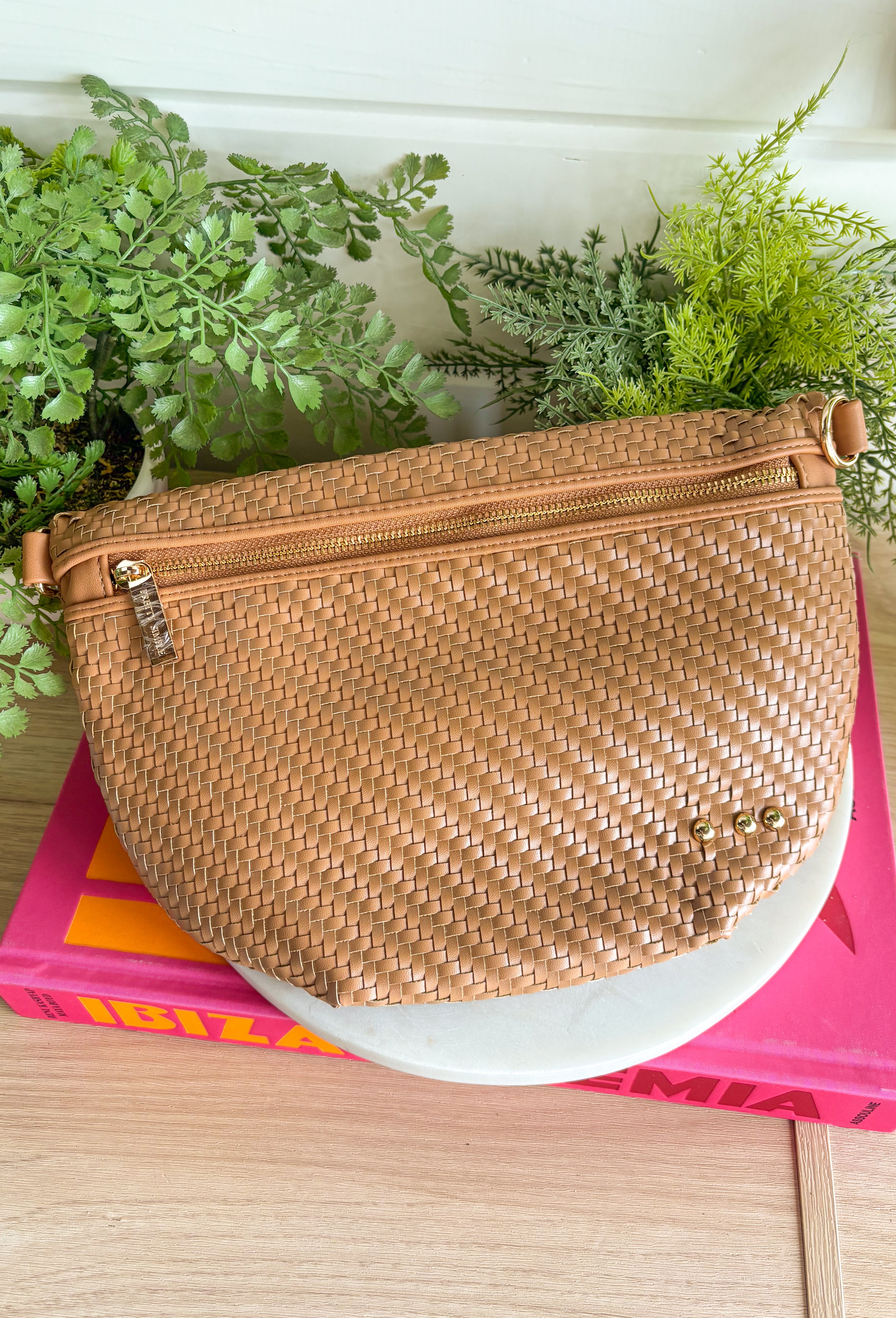 Meet your favorite Westlyn Woven Bum Bag in a new style! Gorgeous diagonal woven design makes this perfect for any occasion! Beautiful hardware with a zipper closure with "Pretty Simple" interior, and a zippered slash pocket on the inside. This crossbody bag is the perfect accessory to elevate any outfit!