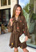 Feminine, chic, and full of seasonal charm, this floral dress is the perfect piece for all your favorite fall occasions. Featuring a classic brown backdrop with a vibrant colorful floral print, this dress offers a timeless silhouette with eye-catching details. The flattering v-neckline is accented by a beautiful scarf tie that adds a polished, sophisticated touch, while the self-tie waist creates a customizable fit you'll love. 