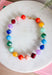 Brighten up any outfit with this colorful chunky beaded necklace that's full of personality and charm. Featuring vibrant beads in shades of navy, blue, green, purple, orange, yellow, and burgundy, this eye-catching accessory is accented with polished gold beads throughout for the perfect hint of shine. The versatile design makes it easy to wear with everything from casual sweaters to your favorite dresses, adding a fun pop of color wherever you go.