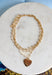An effortless layered look with a sweet touch of shine! This gold layered necklace features delicate strands with small gold beads throughout, finished with a textured gold heart pendant that adds just the right amount of charm. The layered design makes styling easy—giving you that perfectly stacked look in one simple piece. Whether worn with a casual outfit or dressed up for a special moment, this necklace adds a soft, feminine glow to any look.