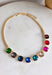 Add a vibrant finishing touch to your jewelry collection with this stunning gold chain necklace. Featuring colorful gemstones in shades of green, blue, gold, pink, red, and burgundy, this chic piece brings the perfect balance of timeless style and playful color. The delicate gold chain makes it easy to wear on its own or layered with your favorite necklaces, creating an effortlessly polished look for any occasion.