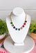 Add a vibrant finishing touch to your jewelry collection with this stunning gold chain necklace. Featuring colorful gemstones in shades of green, blue, gold, pink, red, and burgundy, this chic piece brings the perfect balance of timeless style and playful color. The delicate gold chain makes it easy to wear on its own or layered with your favorite necklaces, creating an effortlessly polished look for any occasion.