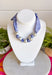 Add a fresh twist to your accessory collection with this versatile scarf necklace that's full of timeless charm. Featuring a beautiful blue and white floral print on one side and a classic blue and white gingham print on the reverse, this unique piece lets you switch up your look with ease. Chunky pearl detailing adds a chic touch, while the scarf tie design allows you to adjust the fit exactly how you like it. 