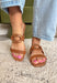 These cognac brown slide sandals are the effortless finishing touch every summer outfit needs! Designed with a sleek silhouette and gold oval buckle detail, they bring just the right amount of polish while still keeping things easy and wearable. The neutral tone makes them incredibly versatile—perfect for pairing with everything from dresses to denim. Whether you're heading to brunch, running errands, or packing for vacation, these slides are a go-to for any occasion. 