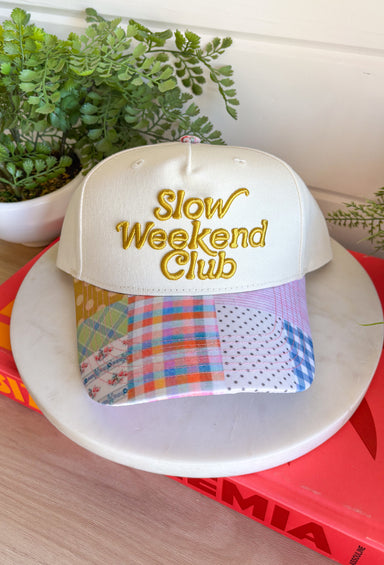 This “Slow Weekend Club” trucker hat is all about those laid-back summer moments! With olive embroidery on a neutral base, it keeps things easy and versatile, while the colorful patchwork bill adds the most fun, unexpected pop. Even better—each hat features a unique patchwork design, so no two are exactly alike. It’s playful, relaxed, and made for coffee runs, errands, or those slower days you actually get to enjoy. Throw it on and lean into those easy weekend vibes—add it to your cart now!