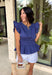 This navy top is such a timeless staple for your summer wardrobe! The rich color feels classic and easy to style, while the elastic waist creates a flattering, effortless shape that’s comfortable for all-day wear. The ruffle sleeves add a soft, feminine touch, and the v-neckline keeps it light and breezy for warm days. Made from breathable cotton, it’s perfect for everything from casual outings to lunch with friends.