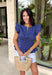 This navy top is such a timeless staple for your summer wardrobe! The rich color feels classic and easy to style, while the elastic waist creates a flattering, effortless shape that’s comfortable for all-day wear. The ruffle sleeves add a soft, feminine touch, and the v-neckline keeps it light and breezy for warm days. Made from breathable cotton, it’s perfect for everything from casual outings to lunch with friends.