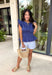 This navy top is such a timeless staple for your summer wardrobe! The rich color feels classic and easy to style, while the elastic waist creates a flattering, effortless shape that’s comfortable for all-day wear. The ruffle sleeves add a soft, feminine touch, and the v-neckline keeps it light and breezy for warm days. Made from breathable cotton, it’s perfect for everything from casual outings to lunch with friends.