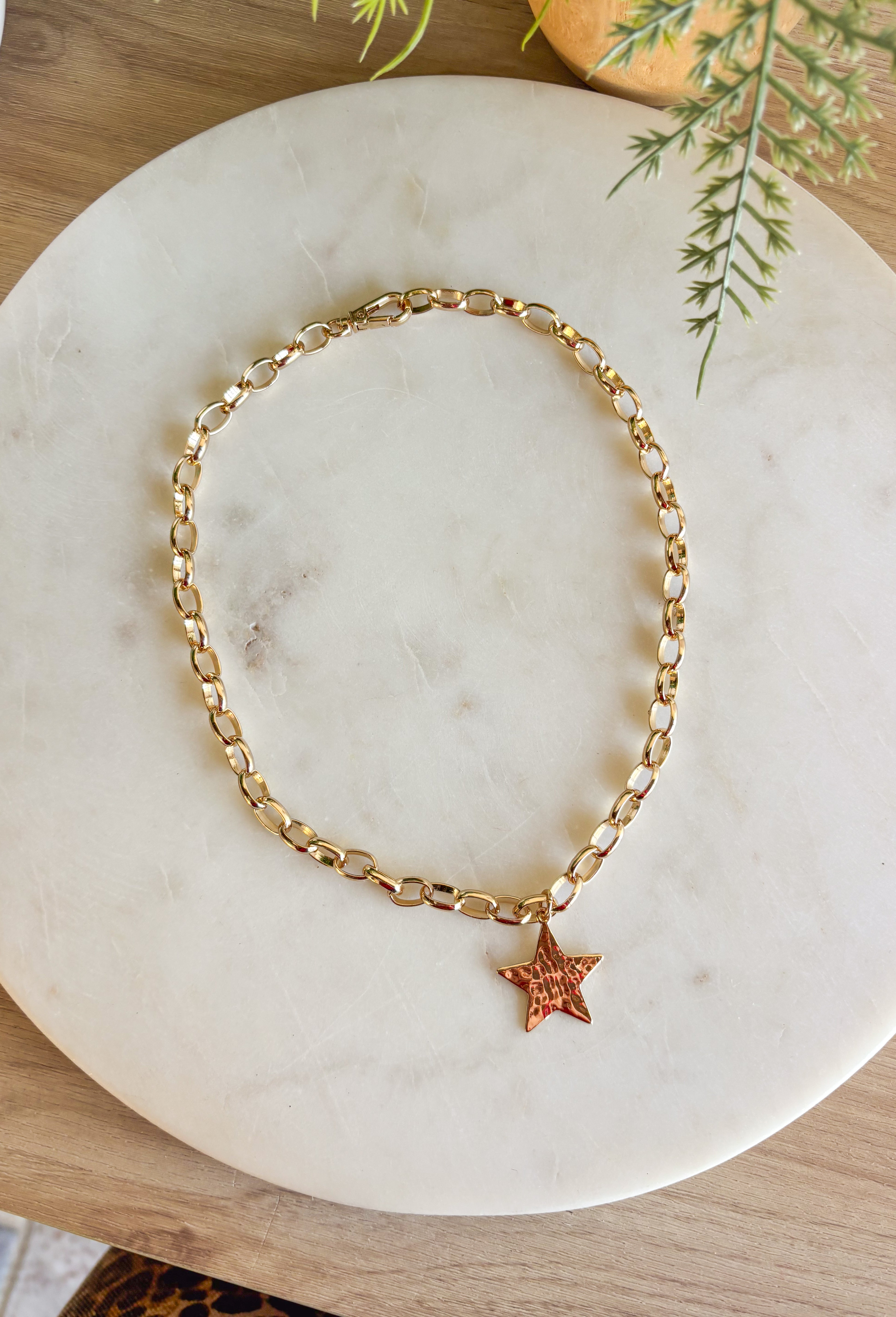Simple and chic, this gold chain necklace is finished with a hammered star charm for just the right touch of texture. Measuring 16" in length, it’s the perfect everyday piece to wear solo or layered with other necklaces. Lightweight and versatile, it adds a hint of shine that works year-round.