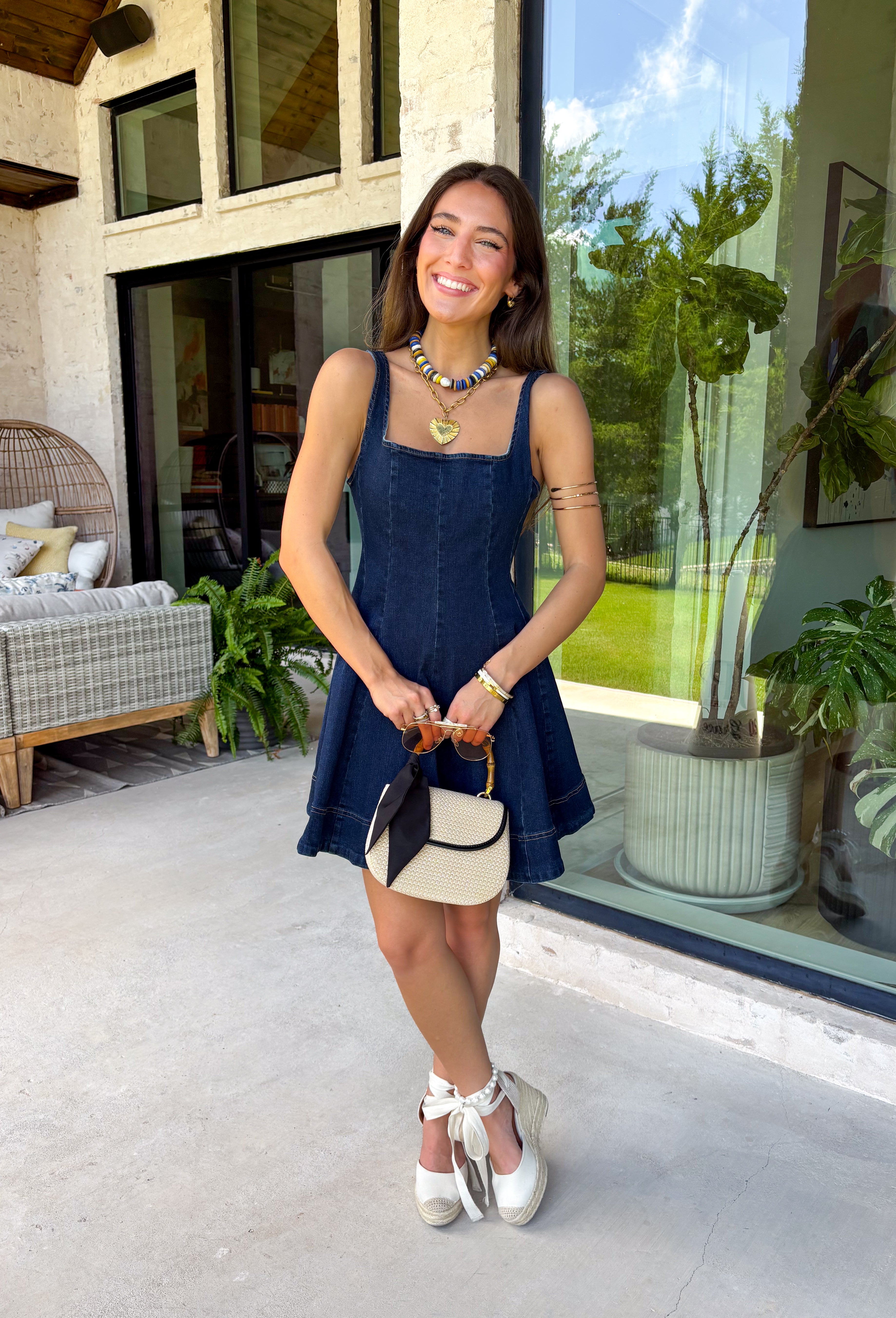 This dark wash denim dress is the kind of timeless staple you'll wear season after season! The flattering A-line silhouette creates an easy, feminine shape, while the rich dark wash gives it a polished feel that's perfect for transitioning into fall. Designed with a sleek zipper closure and a touch of stretch for comfort, this dress is as easy to wear as it is stylish. Whether you're heading to brunch, a football game, or a casual date night, this versatile piece makes getting dressed effortless.