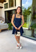 This dark wash denim dress is the kind of timeless staple you'll wear season after season! The flattering A-line silhouette creates an easy, feminine shape, while the rich dark wash gives it a polished feel that's perfect for transitioning into fall. Designed with a sleek zipper closure and a touch of stretch for comfort, this dress is as easy to wear as it is stylish. Whether you're heading to brunch, a football game, or a casual date night, this versatile piece makes getting dressed effortless.