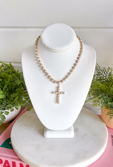 Classic pearls and a meaningful touch come together in this beautiful necklace from Blanche &amp; Co. The gold chain is accented with pearls throughout, creating a timeless look with just the right amount of shine. A pearl cross pendant serves as the centerpiece, adding a sweet expression of faith to the design. Wear it as an everyday reminder or save it for church, celebrations, and special occasions when you want something classic and meaningful.