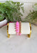 This pink and gold beaded bracelet set is the easiest way to add a fun pop of color to your summer look! Featuring two unique bracelets with a mix of textures and bead sizes, they create that perfectly layered, effortless stack without any extra work. The soft pink tones paired with gold accents feel fresh, playful, and easy to style with everything from casual outfits to dressier looks. Just slip them on and go—they’re made for sunny days, vacations, and everyday wear. 