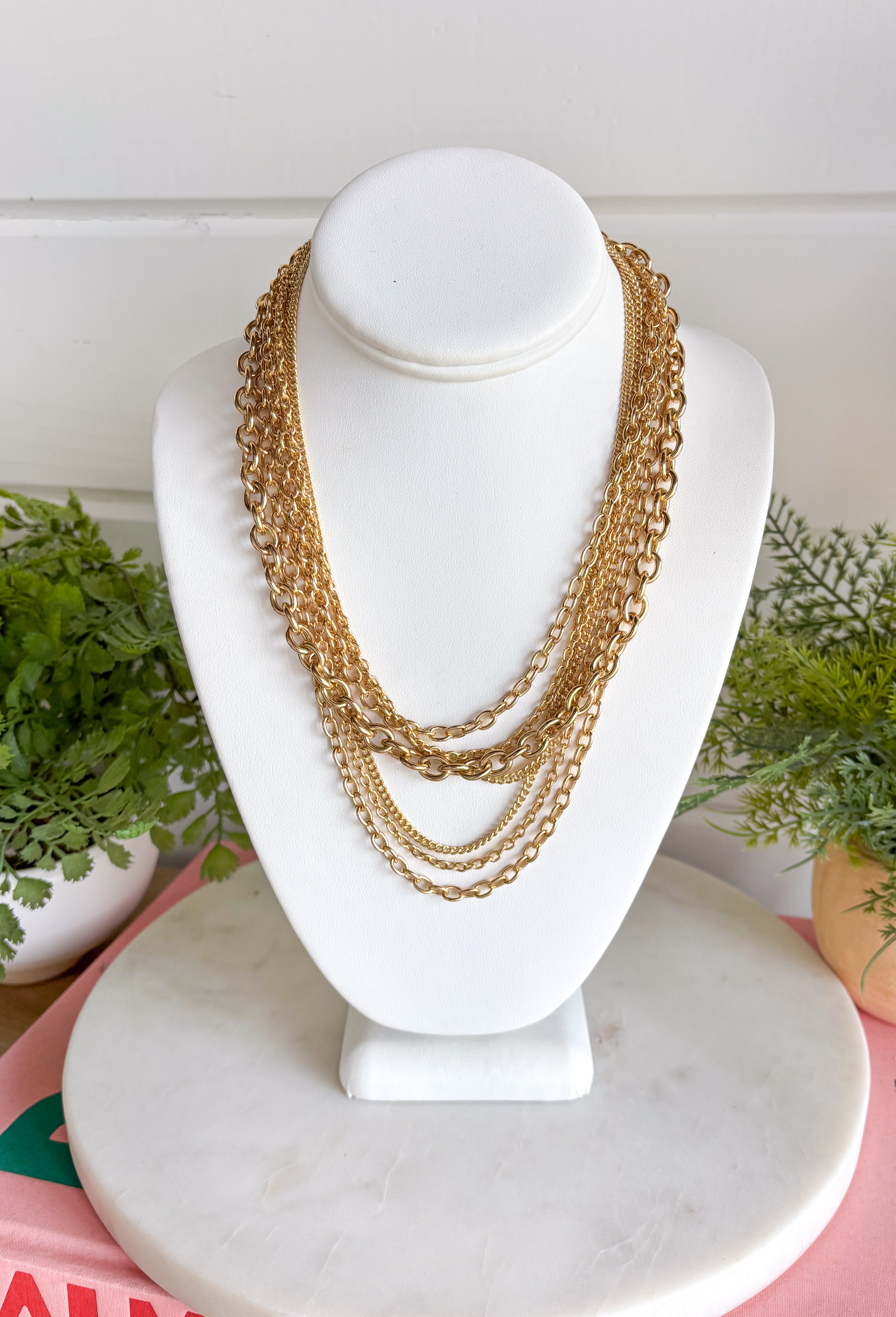 Get the layered look without having to mix and match with this gold chain necklace from Garden Party. Multiple chains come together in one easy piece, giving you that perfectly stacked look with none of the guesswork. The classic gold finish makes it simple to pair with everything from everyday basics to dressier outfits. It’s an easy grab-and-go accessory when your outfit needs a little extra shine.