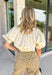 This cream cotton top is the definition of effortless fall style! Designed with a versatile elastic neckline, you can wear it on or off the shoulders depending on your mood and the occasion. The relaxed silhouette is finished with an elastic hem and gathered cuffs, creating a flattering shape that's equal parts comfortable and chic. Crafted from breathable cotton, it's perfect for those crisp autumn afternoons and layers beautifully with your favorite denim jacket or cardigan. 