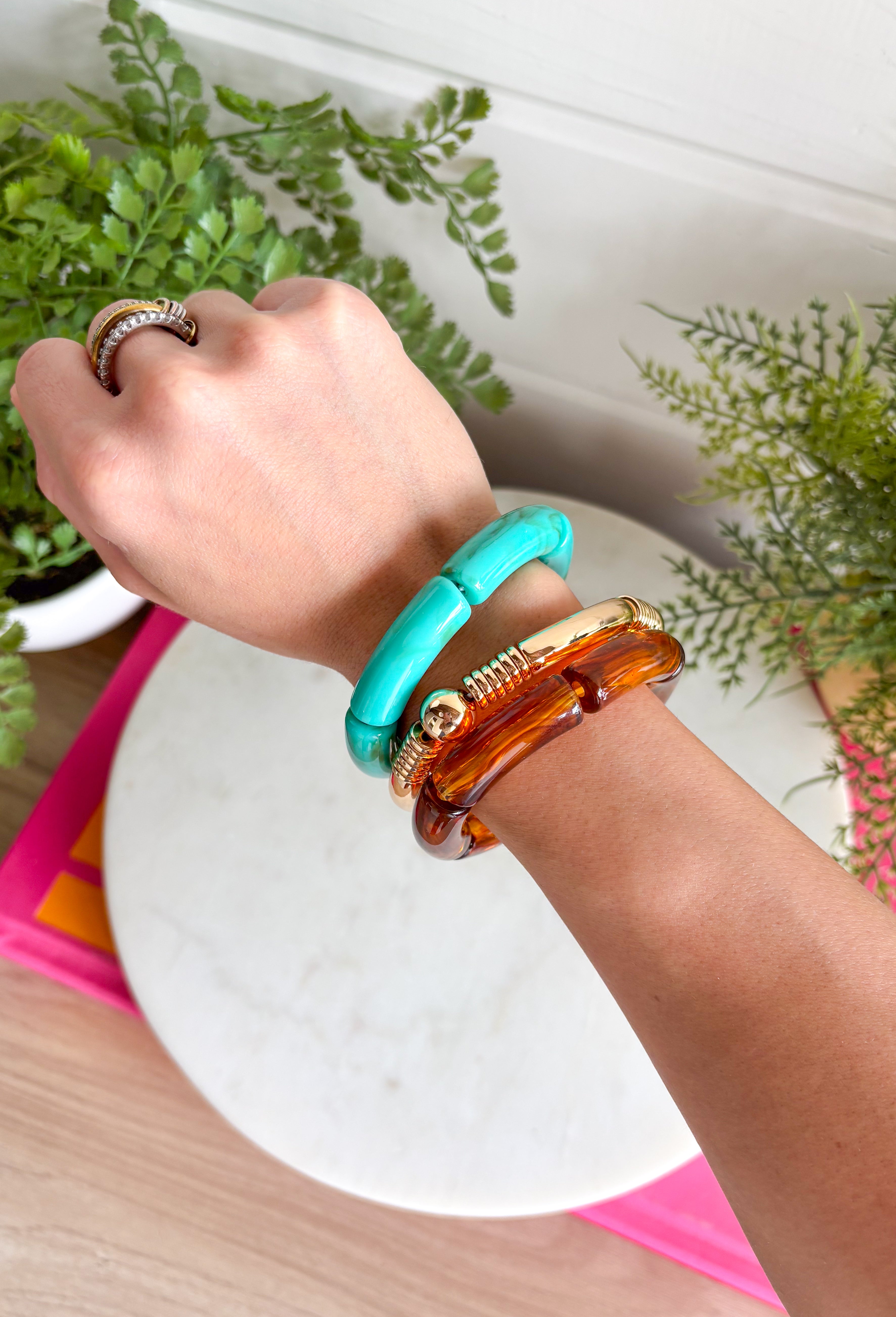 This set of three bracelets is the easiest way to add a little extra to your summer look! Blending turquoise beads, classic gold, and tortoise shell, this set creates an effortlessly styled, perfectly layered look. The mix of textures and tones makes it super versatile—easy to wear with everything from casual outfits to more dressed-up looks. Just slip them on and go for an instant accessory upgrade. Whether you're heading out for the day or packing for vacation, this set is a go-to. 