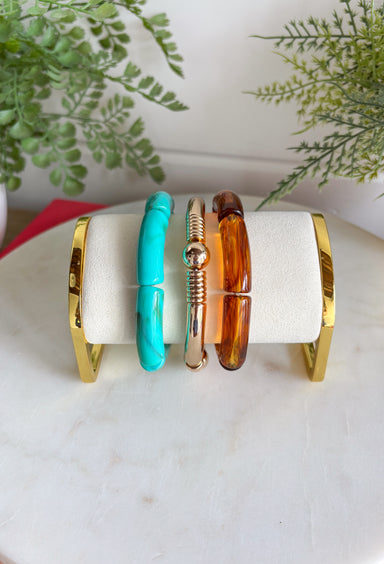 This set of three bracelets is the easiest way to add a little extra to your summer look! Blending turquoise beads, classic gold, and tortoise shell, this set creates an effortlessly styled, perfectly layered look. The mix of textures and tones makes it super versatile—easy to wear with everything from casual outfits to more dressed-up looks. Just slip them on and go for an instant accessory upgrade. Whether you're heading out for the day or packing for vacation, this set is a go-to. 