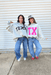 Show your Lone Star pride in this cozy reversible pullover by Bucket List! Crafted from soft fleece, this heather gray mock neck sweatshirt offers two fun looks in one—one side reads “Texas” in bold black lettering, while the reverse features “TX” in bright hot pink. Warm, comfy, and effortlessly cool, it’s perfect for everything from game days to laid-back weekends.