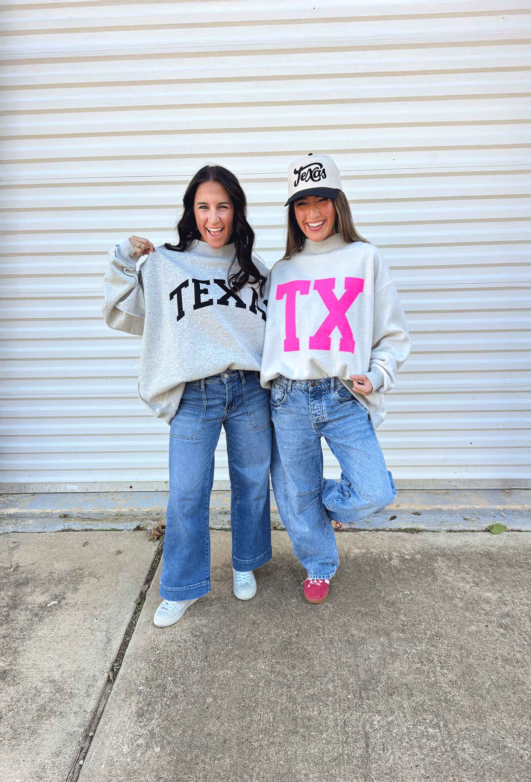 Show your Lone Star pride in this cozy reversible pullover by Bucket List! Crafted from soft fleece, this heather gray mock neck sweatshirt offers two fun looks in one—one side reads “Texas” in bold black lettering, while the reverse features “TX” in bright hot pink. Warm, comfy, and effortlessly cool, it’s perfect for everything from game days to laid-back weekends.