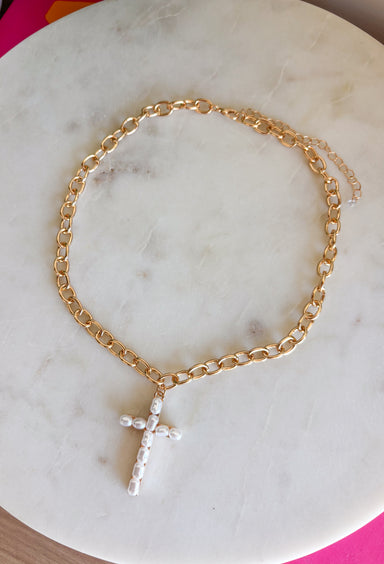This gold chain necklace with a pearl cross pendant is such a meaningful and timeless piece for summer! The gold chain paired with the soft pearl detail gives it a light, feminine feel that’s easy to wear every day. It’s the kind of piece that adds a subtle touch of faith and style to any outfit—whether you're dressing up for church, heading to brunch, or keeping things casual. Perfect for layering or wearing on its own, this necklace is one you’ll reach for again and again. 