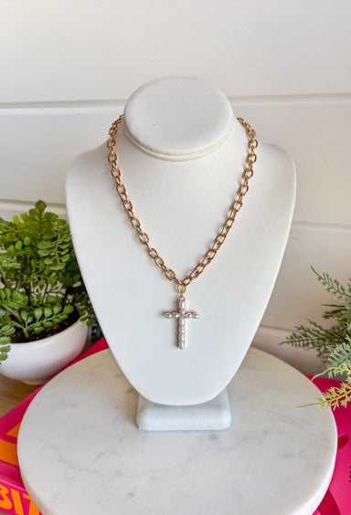 This gold chain necklace with a pearl cross pendant is such a meaningful and timeless piece for summer! The gold chain paired with the soft pearl detail gives it a light, feminine feel that’s easy to wear every day. It’s the kind of piece that adds a subtle touch of faith and style to any outfit—whether you're dressing up for church, heading to brunch, or keeping things casual. Perfect for layering or wearing on its own, this necklace is one you’ll reach for again and again. 