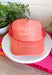 This coral trucker hat is your new go-to reminder to keep things light and positive! With its monochromatic “Today’s A Good Day” design, it’s simple, uplifting, and easy to style with all your summer outfits. The breathable mesh back keeps it cool for those hot, on-the-go days, while the adjustable fit makes it comfortable for all-day wear. Whether you're heading out for errands, a walk, or just enjoying some sunshine, this hat adds the perfect feel-good touch. Go ahead—throw it on and make it a good day!