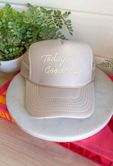 This tan trucker hat is your new go-to reminder to keep things light and positive! With its monochromatic “Today’s A Good Day” design, it’s simple, uplifting, and easy to style with all your summer outfits. The breathable mesh back keeps it cool for those hot, on-the-go days, while the adjustable fit makes it comfortable for all-day wear. Whether you're heading out for errands, a walk, or just enjoying some sunshine, this hat adds the perfect feel-good touch. Go ahead—throw it on and make it a good day!