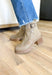 Toula Lug Sole Booties, taupe lug sole bootie with whip stitching around the whole boot, buckle on the top of the boot, wood and gum lug sole 