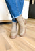 Toula Lug Sole Booties, taupe lug sole bootie with whip stitching around the whole boot, buckle on the top of the boot, wood and gum lug sole 