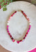 Warm shades of pink and shimmering details make this handcrafted necklace a standout accessory for every season! Featuring beautiful pink beads in a variety of tones accented with gold details, this elegant piece is finished with sparkling heart-cut crystals that add the perfect touch of brilliance. Whether you're dressing up a cozy sweater or adding a feminine touch to your favorite dress, this timeless necklace brings cheerful color and effortless charm to every outfit.
